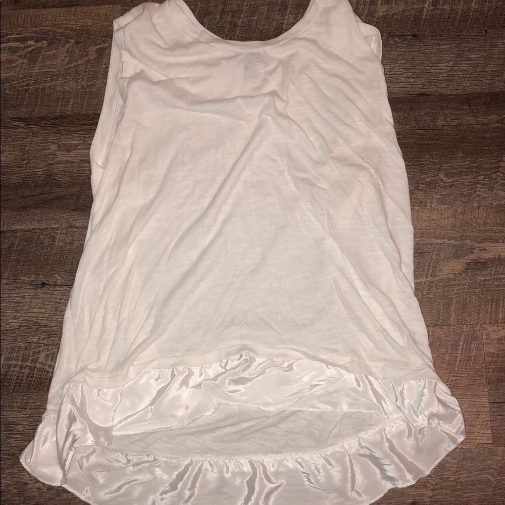 A white blouse with a silk bottom.